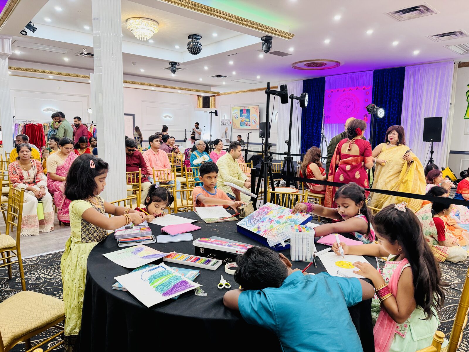 Children doing arts and crafts at TBCS Durga Puja